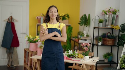 Sticker - Young african american woman florist smiling confident standing with arms crossed gesture at flower shop