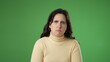 © Robert Peak - Portrait of angry frustrated despair upset portrait of young woman 20s isolated isolated on green screen background.