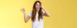 Friendly charismatic enthusiastic happy woman having perfect day show okay ok circle gesture look through ring amused wondered smiling broadly delighted express joy admiration yellow background