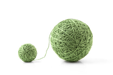 Wall Mural - two green thread balls big and small isolated on white background. balls of natural cotton string.