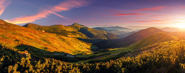 Panorama landscape of Carpathian mountains during sunset. Scenic image of fantastic atmosferic scenery with picturesque sky, mountain range under vivid sunlit. Amazing nature scenery. creative image