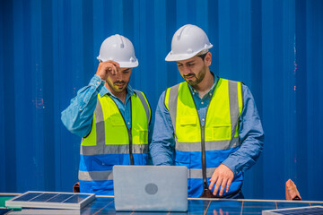 solar power plant engineers meeting and examining photovoltaic panels. Concept of alternative energy and its service. Engineer energy power man worker at site.