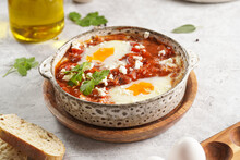 Traditional North African Dish Shakshouka Made Of Eggs Poached In A Sauce Of Tomatoes, Olive Oil, Bell Peppers, Onion And Garlic, Spiced With Cumin, Paprika And Cayenne Pepper