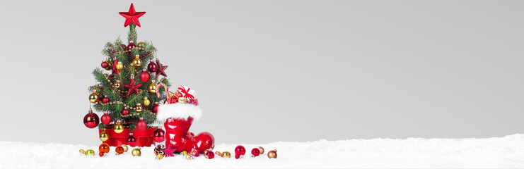 Wall Mural - christmas tree with decoration on a winter background.