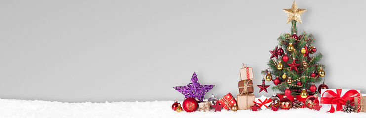 Wall Mural - christmas tree with decoration on a winter background.