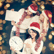 © yurolaitsalbert - happy women in costume of Santa Claus with clock, and Christmas shopping. Beautiful bokeh effect from a garland.