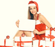 © yurolaitsalbert - beautiful young woman in Christmas suit with blank poster