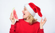© be free - Woman santa hat hold slice watermelon. Exotic christmas celebration. Christmas summer destinations. Tropical christmas concept. Travel vacation and holidays resort. Christmas girl eat watermelon