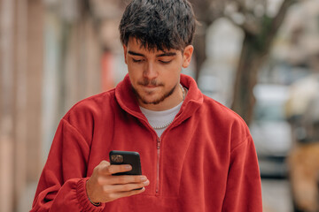 Canvas Print - boy with mobile phone in the street