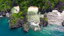 Tropical Island With Sandy With Tourists And Blue Sea, Aerial View. Matukad Island, Caramoan Islands, Philippines. Summer And Travel Vacation Concept.