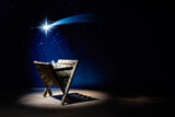 Fototapeta Kawa jest smaczna - Nativity of Jesus, empty manger at night with bright lights.