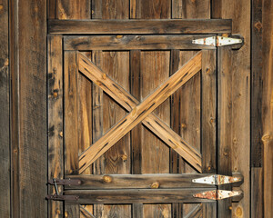 Wall Mural - Wooden X pattern on weathered wooden door