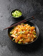 © grinchh - Spicy bamboo shoot salad in black bowl. Asian food
