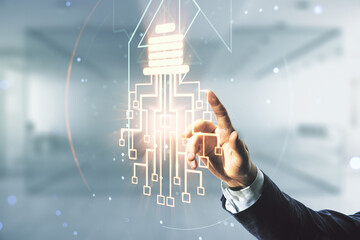 Man hand working with virtual creative idea concept with light bulb and microcircuit illustration on blurred office background. Neural networks and machine learning concept. Multiexposure