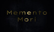 Memento mori text with golden letters on black textured grunge background