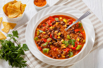 Wall Mural - taco soup of ground beef, corn, beans and veggies