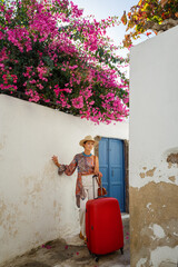 Wall Mural - Young woman came to the island of Santorini