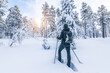 © Nancy Pauwels - Snowshoe hiker walking in the snow. Outdoor winter sport activity and healthy lifestyle concept.