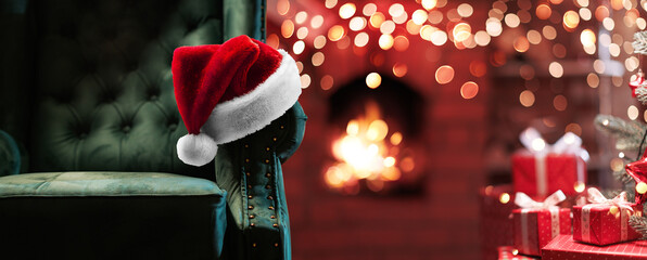 Wall Mural - throne of santa claus near the fireplace with fire and illumination. festive magic room