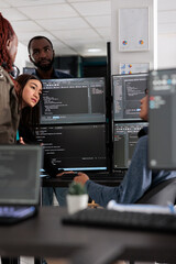 Wall Mural - multi ethnic engineers analyzing server code and database, brainstorming program ideas to develop ne