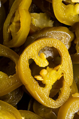 Wall Mural - The texture of chopped jalapeno peppers as a background. A close shot of chopped Mexican jalapeno peppers. Macro photo. Jalapeno peppers very close up.