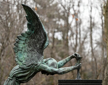 Copper Angel Statue In A  Cemetery