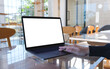 © Farknot Architect - Mockup image of a woman using and touching on laptop computer touchpad with blank white desktop screen