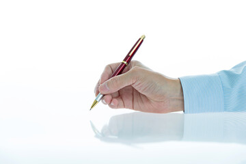 Wall Mural - Businessman hand holding a pen isolated on white background