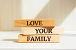 Wooden blocks with words 'Love Your Family'.