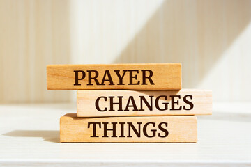 Wooden blocks with words 'Prayer Changes Things'.