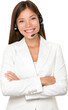 © Maridav - Beautiful cheerful young Asian call operator, receptionist or personal assistant wearing a headset and microphone standing with her arms folded isolated cutout PNG on transparent background.