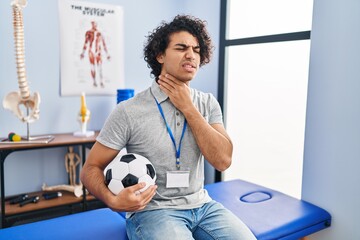 Canvas Print - Hispanic man with curly hair working as football physiotherapist touching painful neck, sore throat for flu, clod and infection