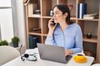 © Krakenimages.com - Young woman talking on the smartphone working at home