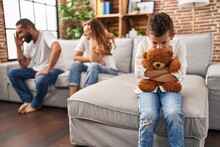 Family Sitting On Sofa And Kid Sad For Partents Argue At Home