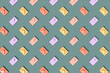 © Westend61 - Three dimensional pattern of rows of pastel colored envelopes flat laid against green background