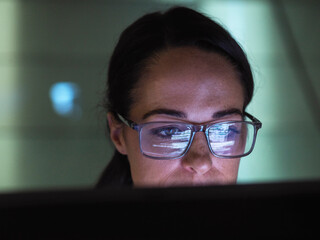 Focused programmer working on computer