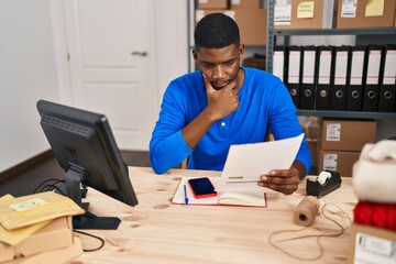 Sticker - Young african american man ecommerce business worker worried reading document at office