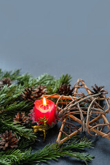 Poster - Candle, amulet with deer and pentacle star, fir branches on dark abstract background.  Witchcraft Esoteric Ritual. symbol of Christmas, Yule, Winter Solstice wiccan holiday. copy space