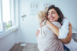 © Dragana Gordic - A hug makes everything better. Shot of a young woman hugging her doctor during a consultation. Healthcare worker. Young care specialist is sitting beside granny and hugging her.