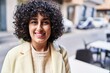 Young middle east woman excutive smiling confident standing at street