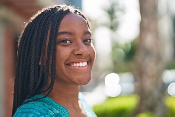 African american woman smiling confident standing at street