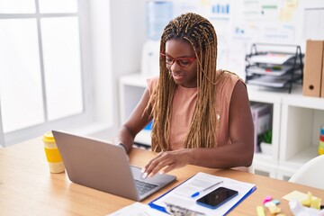 African american woman business worker using laptop working at office