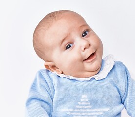 Adorable baby smiling confident over white isolated background