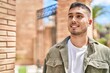 © Krakenimages.com - Young hispanic man smiling confident standing at street