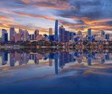 Sydney Harbour Australia At Sunset With The Reflection Of The Buildings And High Rise Offices Of The City In The Water