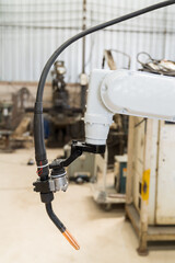 Poster - Close-up of automatic robot arm system welding machine in the industry factory. Industry robot manufacturing technology