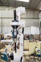 Poster - Close-up of automatic robot arm system welding machine in the industry factory. Industry robot manufacturing technology