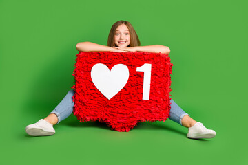 Sticker - Full body portrait of excited positive person sit floor behind huge like collage isolated on green color background