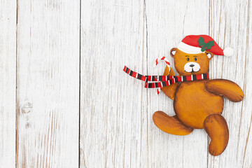 Wall Mural - Cute Santa bear on weathered wood holiday background