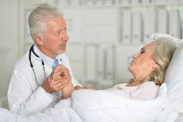 Sticker - old woman portrait in hospital with caring doctor